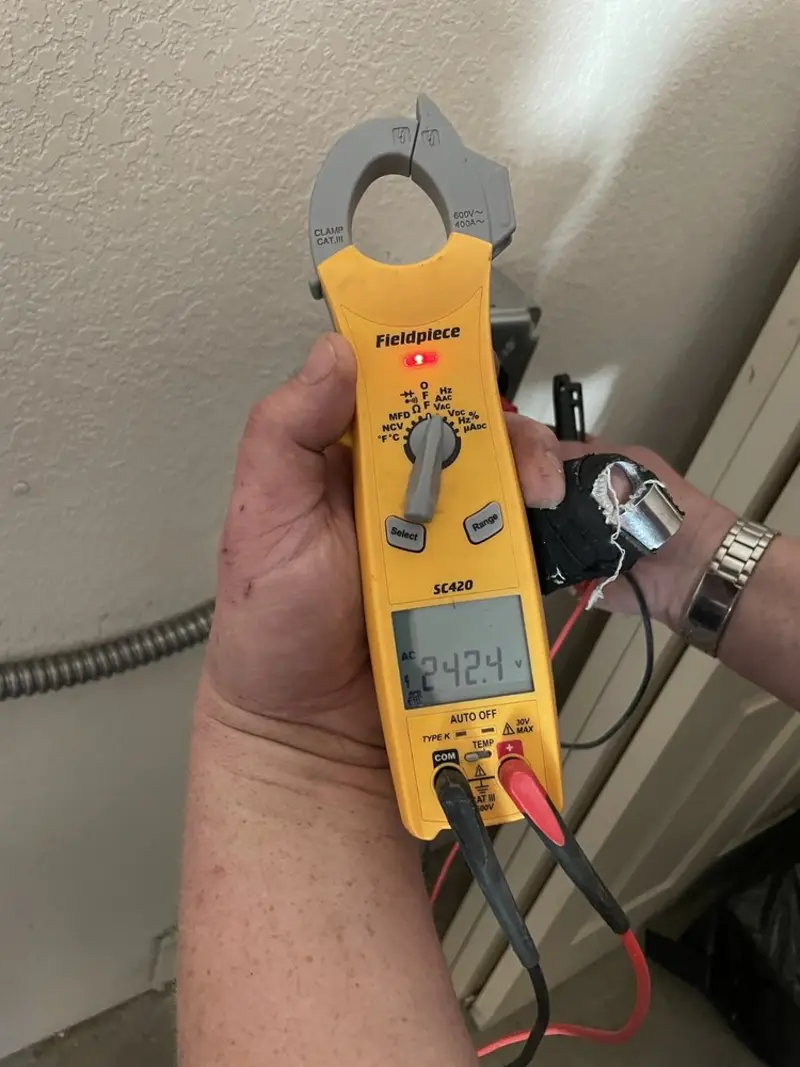 Voltage testing with clamp meter during Recessed Lighting Installation in Whitemarsh
